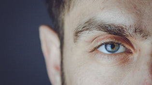  Closeup on a man's eye and ear | Style Standard